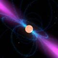 This image shows an artist's impression of a neutron star, surrounded by its strong magnetic field (blue). It emits a narrow beam of radio waves (magenta) above its magnetic poles. When the star's rotation sweeps these beams over the Earth, the neutron star can be detected as a radio pulsar. Credit: NASA Goddard/Walt Feimer,
